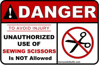 Sign - Danger to avoid injury unauthorized use of sewing scissors is not allowed